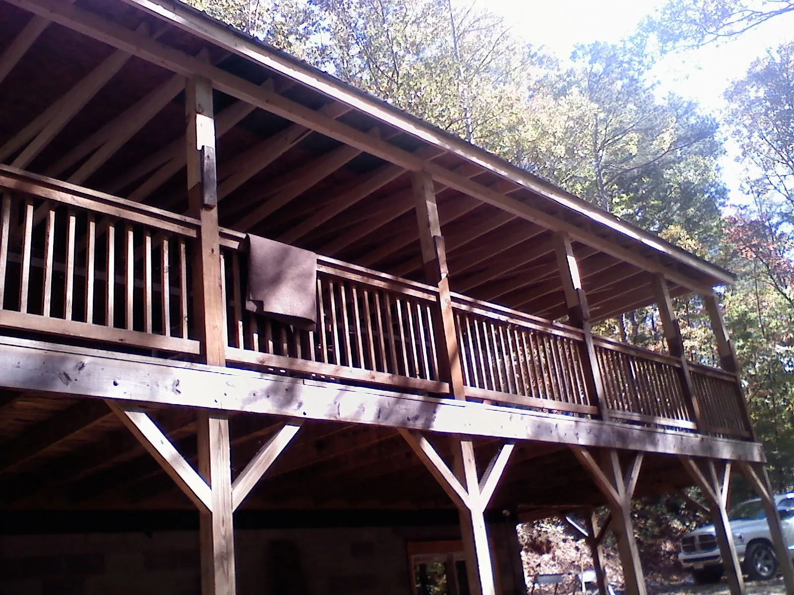 Timber framing under a new elevated porch and deck — Roof Leak Repair in Wilmont by Roofing Brothers